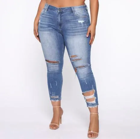 Distressed Mid Rise Skinny Jean - Medium Wash