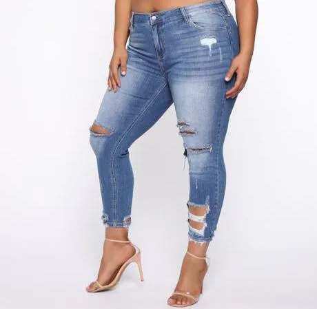 Distressed Mid Rise Skinny Jean - Medium Wash